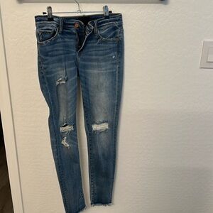 Buckle black skinny jeans